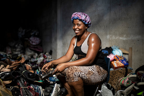 woman with donated shoes